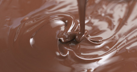 pour milk chocolate from spoon