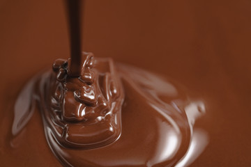 pouring melted premium dark chocolate