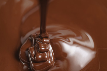pouring melted premium dark chocolate