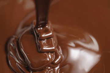 pouring melted premium dark chocolate