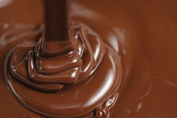 pouring melted premium dark chocolate
