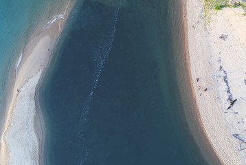 Sand bar forming at the sea shore. Beautiful colors as seen from above.