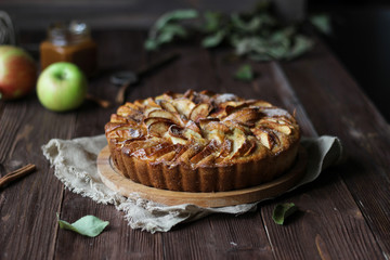 Apple pie on a wooden background