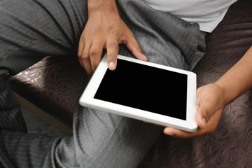 Man browsing on tablet pc