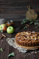 Apple pie on a wooden background