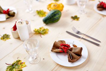 Decorative Thanksgiving objects on festive table prepared for celebration