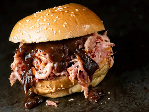 rustic american barbecued pulled pork sandwich