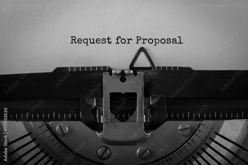 Fototapete text request for proposal typed on retro typewriter