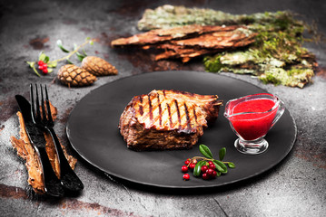 Grilled steak with cranberry sauce