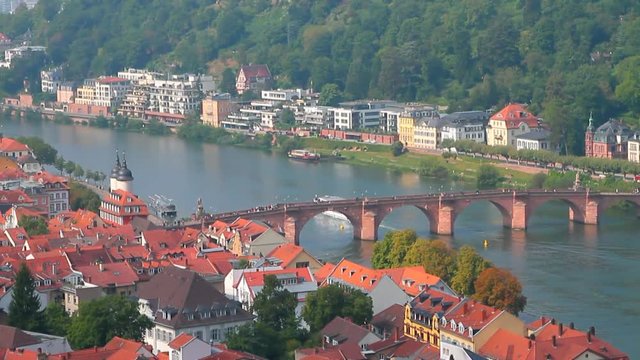 Ancient city and bridge through river. Heidelberg, State Baden-Wrttemberg, Germany