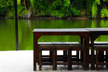 Fototapeta premium Wood table near the water