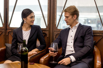 Woman testing Wine with attracitve smiling at restaurant. People Drinking Wine with Relax emotion.