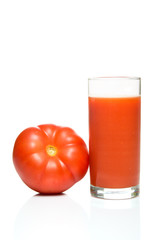 Glass of tomato juice with tomato fruit isolated on white background