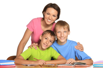 Mother and sons doing homework