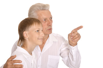 senior man hugging grandson