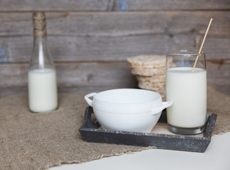 Milk and cereals on the linen tablecloth