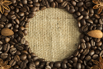 coffee beans and star anise on coarse fabric