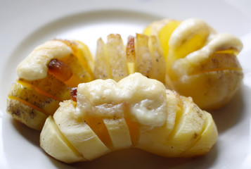 Baked potatoes with meat and cheese.