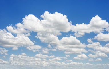 Blue sky background with tiny clouds