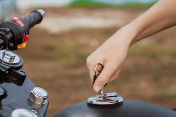 Hand the key open tank cap motorcycle fuel tank.