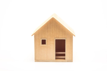 Toy wooden house model on white
