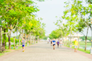 Obraz premium blur runner exercise with running or jogging on the morning in the park for healthy.