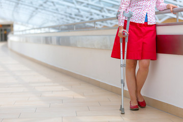 woman with crutches standing in the hospital