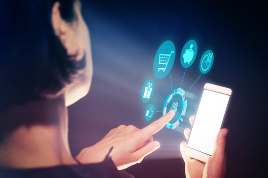 Image of a woman with a smartphone in her  hand. She makes purchases with her gadget.
