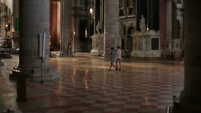 Guy and girl in church of San Giovanni Paolo