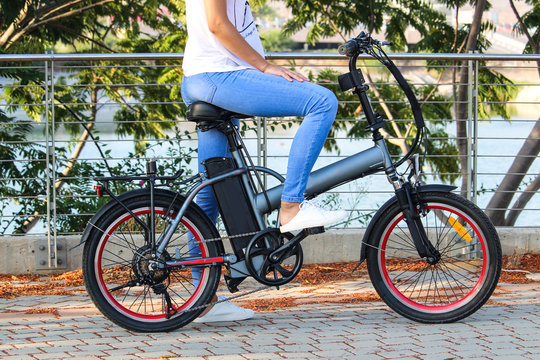 Women with electric ebike With lake view
