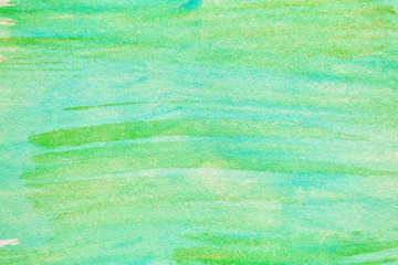 background strokes of green yellow paint on watercolor paper, texture