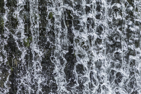 Fototapeta pattern of flowing water at a waterfall gives a harmonic background