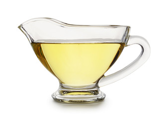 Glass gravy boat with sunflower oil isolated
