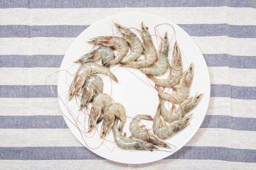 Fresh shrimp on a white plate