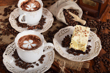 coffee with milk foam in the shape of a flower in a retro cups