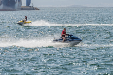 Obraz premium young man on a jet ski on the sea