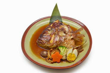 Steamed salmon Head with soy sauce in green plate Japanese style on white background