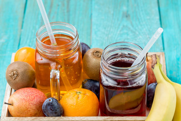 Glasses of juise with fruits on table