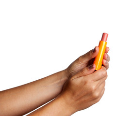 Woman holding pink lipstick in her hand. 