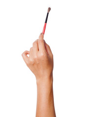 Isolated hand holding a paintbrush. Brush painting on white background. 