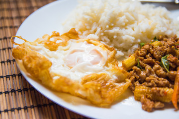 Rice topped with stir-fried pork and basil