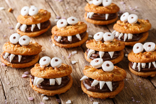 Toothed monsters of cookies close-up for Halloween. horizontal