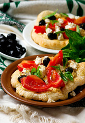 Hummus pita pizzas.
