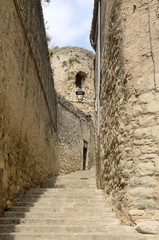 Narrow cobblestone alley in Girona, Spain