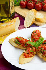 Bruschetta on white plate, traditional italian food