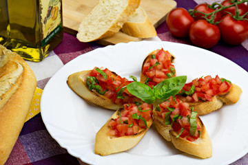 Bruschetta on white plate, traditional italian food