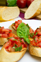 Bruschetta on white plate, traditional italian food