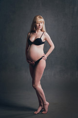 Picture of beautiful nude pregnant woman.
