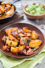 Fried roasted potatoes with pork meat, green bean, bacon and onion