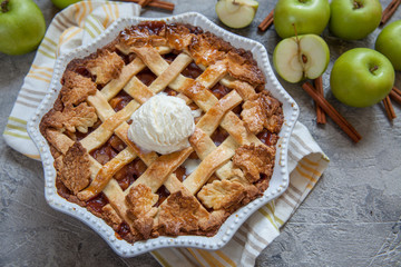 Traditional American Apple pie with fall autumn leaves food decoration